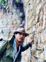 Ramy Romany examines a wall