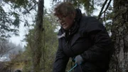 Mary Miller pulls a cord attached to her skiff in an attempt to bring it to its side.