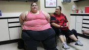 Annjeanette and her girlfriend are in a consultation room.
