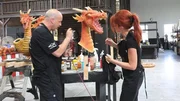 Brett helps Lisa paint the dragon for Steve Aoki's tank.