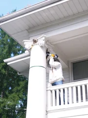 Dave Marrs opening up the bee infested support column at his newly purchased property, as seen on Fixer to Fabulous: Welcome Inn.
