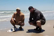 Eric Young and Shawncy Perez start a day at the beach.