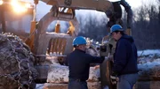 Rudy Pelletier talks with the operator of a grapple skidder on a worksite at the Pelletier's vast logging operation in Northern Maine.
