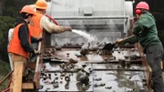 Thurber and crew moving rocks through the shaker.