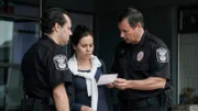 Officer (SIMON THOMSON) shows photo of Sherri (THANDI BUCHAN) to a witness.