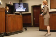 BONES: Brennan (Emily Deschanel, L) answers questions from Heather Taffet (Deirdre Lovejoy, R) who is representing herself during the Gravedigger trial in the BONES episode 'The Boy with the Answer'.
