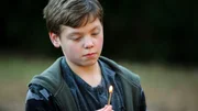 Michael Formoso (Young Kevin) lighting a match
