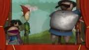 Ein Puppenspieler bringt die Bewohner von Nottingham mit Figuren von Prinz John, dem Sheriff und Robin Hood zum Lachen.