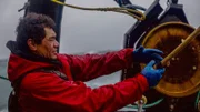 Freddy Maugatai, veteran deckhand on the Wizard, pulling the line through the block.; Canon 5D Mark iii