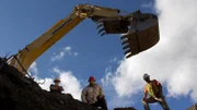 Jack and Todd Hoffman at near the whoe of the first cut with the Hitachi 200 Excavator at the Claim.