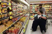 Angie gets pushed through grocery store in wheelchair by boyfriend