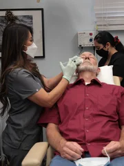 Dr. Lee injects numbing solution into Wesley Gretzinger eye growth.
