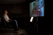 Mike Shibley watching home videos.