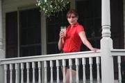Jennifer Clark on the porch watching Michael Yost.