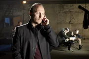 Januscheck telefoniert mit dem unbekannten Auftraggeber.