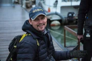 New Captain George Young charms on the dock.