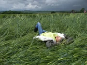 Wiltsire, England, UK - Monique Klinkenbergh, crop circle researcher and investigator takes a much needed break and rests in a new crop formation.