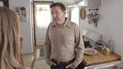 MS actor David Schifter (Donald Gaskins) standing in kitchen