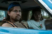 TERRY (KAI LUKE BRUMMER) pulls up. CRAIG (ROWAN STUDTI) jumps in and they drive off.