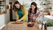 Host Molly Yeh, with her guest Anna Sather, assembling her Mini Rose Water Trifles with Cardamom Cream, as seen on Girl Meets Farm, Season 3.