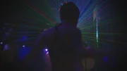 Miami, Florida, USA: A 'clubber' dances in a nightclub while a light show goes on behind him. Miami, Florida, USA: A 'clubber' dances in a nightclub while a light show goes on behind him.