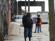 Earl standing out front VRC on phone.