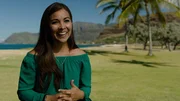 Realtor Jennifer Haole standing by the ocean as seen on Hawaii Hunters (portrait)