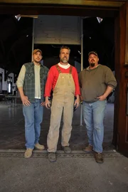 Mark, Jay and Dan stand in front of the upper gymnasium.
