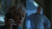Taw walks in on Loretta Bowersock on the phone with the bank.