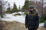 Forrest Galante stands on trail in search for Newfoundland Wolf.
