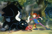 Tommy wird von einem wilden Stier angegriffen, dem Pippi gehörig die Meinung sagt.