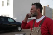 Jay talks with his team members on the phone.