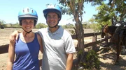 Clients Maq and Char Serang pose next to horses