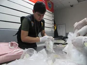 LIMA, PERU - Officials with the drugs.