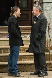 "Dead Man's Switch"--    Sherlock (Jonny Lee Miller, left) and Gregson (Aidan Quinn, right) hunt for the accomplice of a murdered blackmailer who had been targeting the families of rape victims threatening to release videos of the assault if they don‚Äôt pay, on ELEMENTARY, Thursday, April 25 (10:00-11:00 p.m. ET/PT) on the CBS Television Network.  PHOTO CREDIT: Barbara Nitke/CBS ¬© 2012 CBS. All Rights Reserved