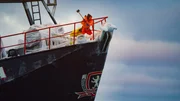 The Saga crew breaks ice on the bow.
