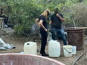 Mariana van Zeller (L) and a masked individual  check meth during cooking process.