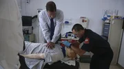 Stan Goettel and his assistant demonstrate resuscitation on a dummy.