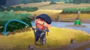 Der Bauer gießt sein Gurkenfeld maßlos, während im Hintergrund ein trauriger Frosch den niedrigen Wasserstand betrachtet.