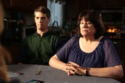 Jason Westervelt and Wendy Westervelt are seated next to each. He stares straight ahead, while she stares at the table.