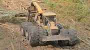 Closeup of skidder hauling trees.