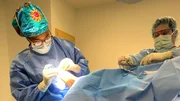 Dr. Ebonie is inspecting Brooklyn Jackson’s foot in surgery.