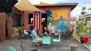 Exterior, Clients Ramon and Ronald Sitting at a restaurant in Vieques, Puerto Rico. As seen on HGTV's Caribbean Life.
