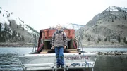 Dax Dewey stands on the boat at Mackay Bar.