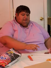 Isaac sits at table with snacks Isaac sits at table with snacks