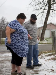 Krystal stands outside car Krystal stands outside car