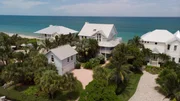Aerial of the front of the Vero Beach House, with lots of palm trees to assist with privacy. As seen on HGTV's Beach Hunters.