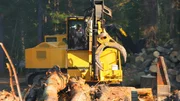 Logger operating the Shovel Logger.