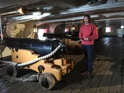 Dan Pascoe explaining flintlock canons that would have been used on HMS Invincible