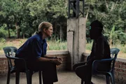 Mariana van Zeller (L) conducts an interview about cocaine trafficking.
